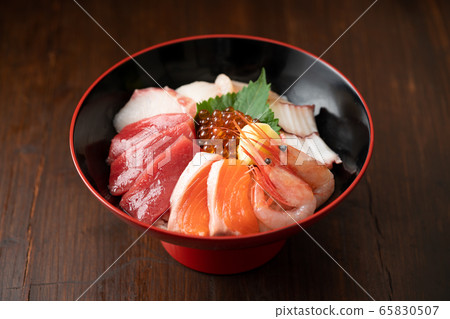 Bowl of rice topped with sashimi Bowl of rice topped with sashimi 65830507