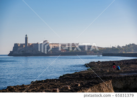 People fishing in front of the Fortress of Morro, Havana, Cuba 65831379