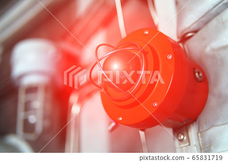 Fire alarm with red warning light of an emergency 65831719