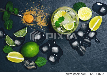 Fresh mojito drink on black background. 65833634