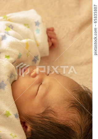 Infant's sleeping face 65835807