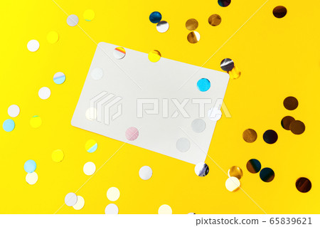 Blank White page mock up and sparkles confetti on Yellow. Blank White page mock up and sparkles confetti on Yellow. 65839621