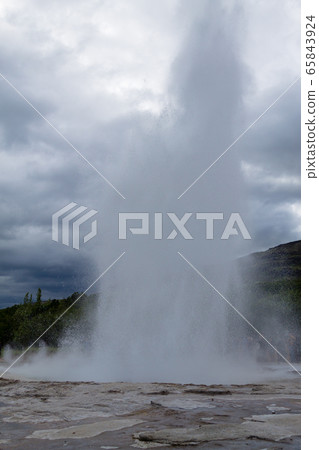 Strokkur geyser eruption. Geysir geyser view, 65843924