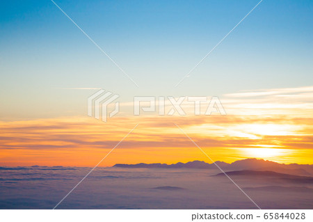 Mountain silhouette at sundown 65844028