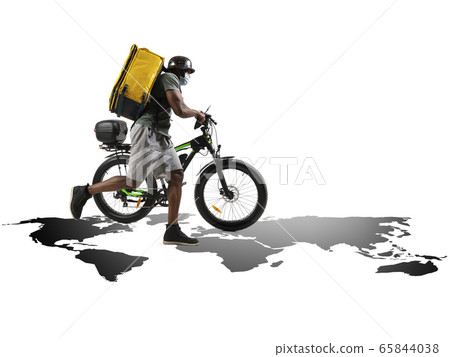 Home delivery, food purchase via the Internet. Deliveryman on bike arriving to any address worldwide on the map with your order. 65844038