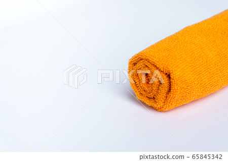roll orange towel placed on white background roll orange towel placed on white background 65845342