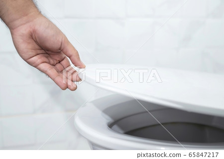 Hand open toilet at home 65847217