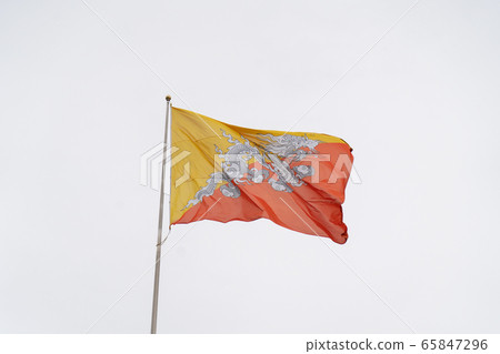 Bhutan Flag on the Cloudy Sky Bhutan Flag on the Cloudy Sky 65847296