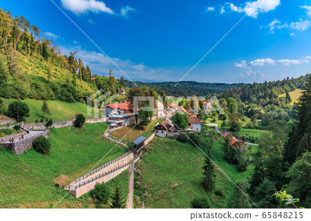 Predjama, Slovenia. The Predjamski Grad or Predjama Castle, a Renaissance fortress near Postojna in the mouth of a cave, Scenic View Of Landscape Against Sky Predjama, Slovenia. The Predjamski Grad or Predjama Castle, a Renaissance fortress near Postojna in the mouth of a cave, Scenic View Of Landscape Against Sky 65848215