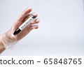 hand doctor in glove holds a test tube with a 65848765