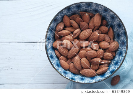Top view of almond nuts on table with copy space Top view of almond nuts on table with copy space 65849869