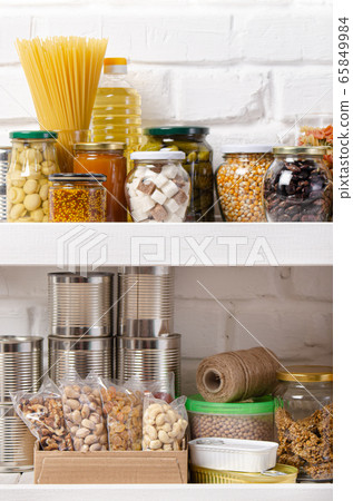 Set of non-perishable foods on pantry shelf on 65849984