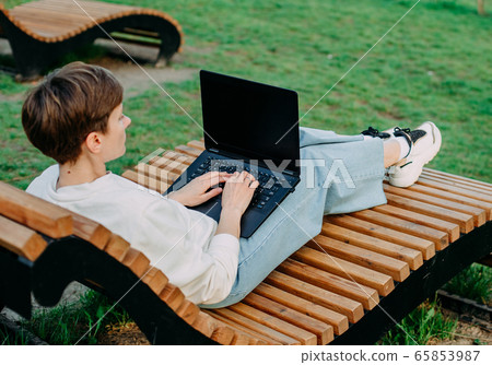 summer vacation park bench woman laptop summer vacation park bench woman laptop 65853987