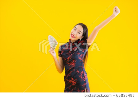 Portrait beautiful young asian woman wear chinese dress with a lot of cash 65855495