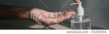 Hand sanitizer dispenser bottle man using antibacterial gel to clean disinfect hands for coronavirus prevention COVID-19 in public transport. Panoramic banner background 65859050