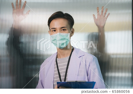 Doctor in hospital over zombie behind the wall Doctor in hospital over zombie behind the wall 65860056