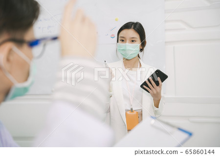 Beautiful nurse giving presentation. Beautiful nurse giving presentation. 65860144