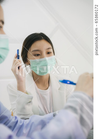 Doctor finding cure inside hospital. 65860172