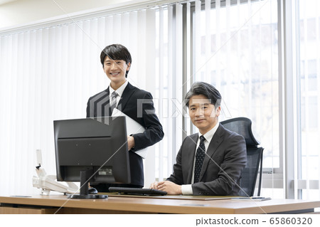 Business scene: young and experienced image 65860320