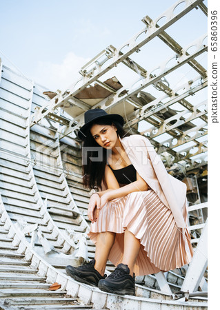 Thai woman sitting on a wreck. Thai woman sitting on a wreck. 65860396