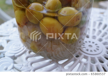 Bottled sugar plum making Ume sugar plum material background Bottled sugar plum making Ume sugar plum material background 65860537