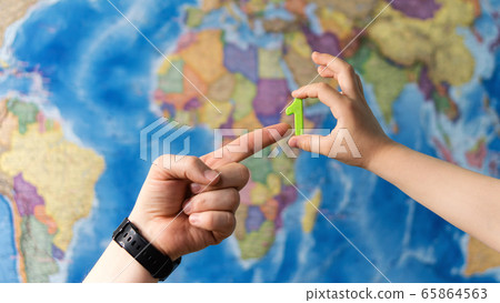 Hand holding plastic toy Hand holding plastic toy 65864563