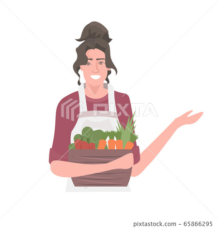 beautiful woman gardener holding basket with fresh vegetables healthy nutrition eco vegan food concept beautiful woman gardener holding basket with fresh vegetables healthy nutrition eco vegan food concept 65866295