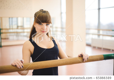 Dancer is doing exercises in ballet class Dancer is doing exercises in ballet class 65866389