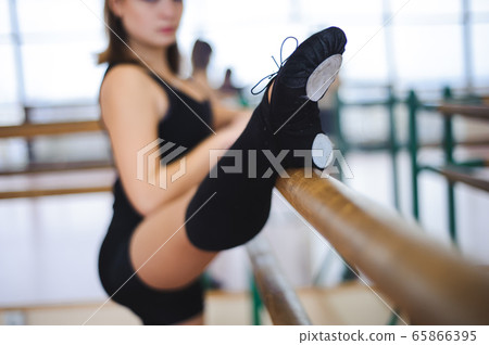 Dancer is doing exercises in ballet class Dancer is doing exercises in ballet class 65866395