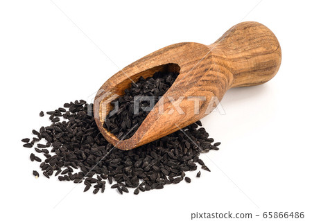 Nigella sativa or Black cumin in wooden scoop isolated on white background 65866486