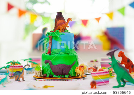 Kids birthday party. Dinosaur theme cake. Kids birthday party. Dinosaur theme cake. 65866646
