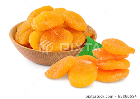 Dried apricots in wooden bowl isolated on white background with full depth of field. Dried apricots in wooden bowl isolated on white background with full depth of field. 65866654