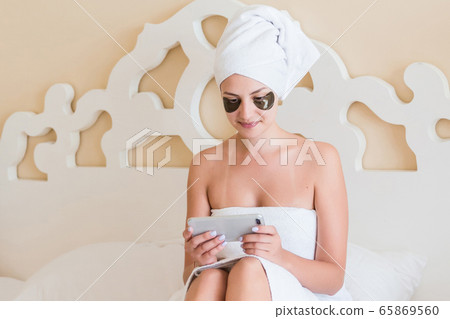 Beautiful woman wrapped in towel after morning 65869560