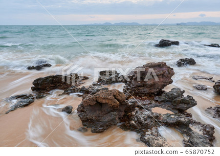 wavy seaside rocks 65870752