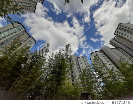 Apartments and clouds 65871246