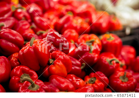 Footage of fresh ripe red sweet bell pepper in box on sale at grocery food store. Footage of fresh ripe red sweet bell pepper in box on sale at grocery food store. 65871411