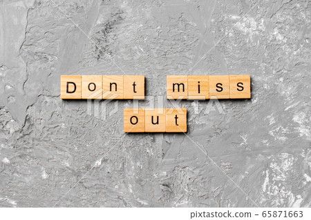 Don't miss out word written on wood block. Don't Don't miss out word written on wood block. Don't 65871663
