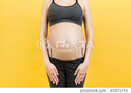 Cropped image of pregnancy belt dressed on Cropped image of pregnancy belt dressed on 65871743