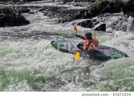 Kayaker in whitewater Kayaker in whitewater 65872838