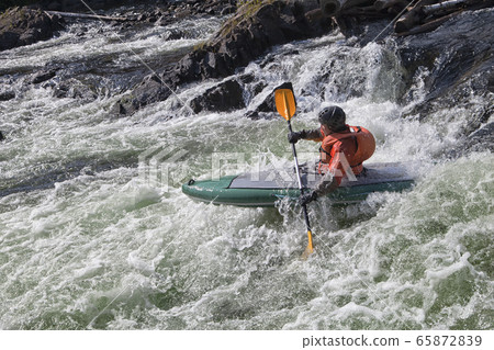 Kayaker in whitewater 65872839