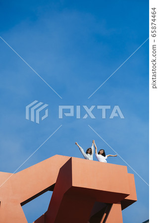 Girls with clear sky. 65874464