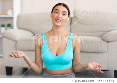 Sporty Girl Showing Her Home Training Making Video Indoors Sporty Girl Showing Her Home Training Making Video Indoors 65875125