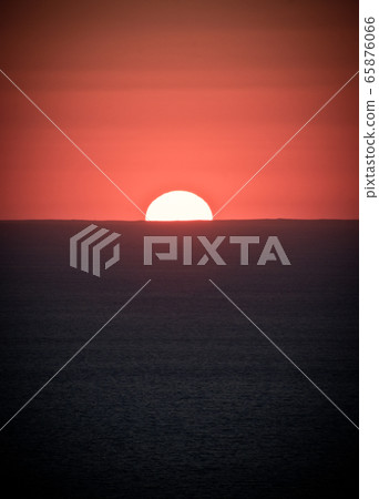 A sign in front of a sunset A sign in front of a sunset 65876066