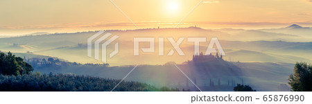 Tuscany landscape at spring foggy sunrise 65876990