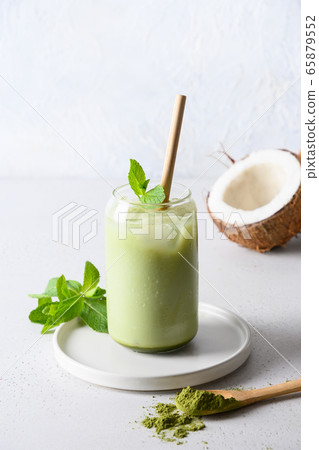 Iced Green matcha tea with coconut milk on white 65879552