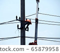 electrician man working at height and dangerous ,high voltage power line maintenance 65879958