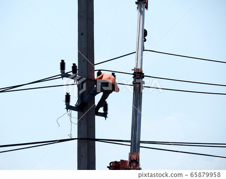 electrician man working at height and dangerous ,high voltage power line maintenance electrician man working at height and dangerous ,high voltage power line maintenance 65879958