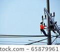 electrician man working at height and dangerous ,high voltage power line maintenance 65879961