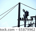 electrician man working at height and dangerous ,high voltage power line maintenance 65879962