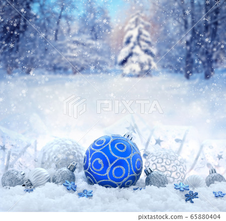 Christmas decorative balls on snow 65880404